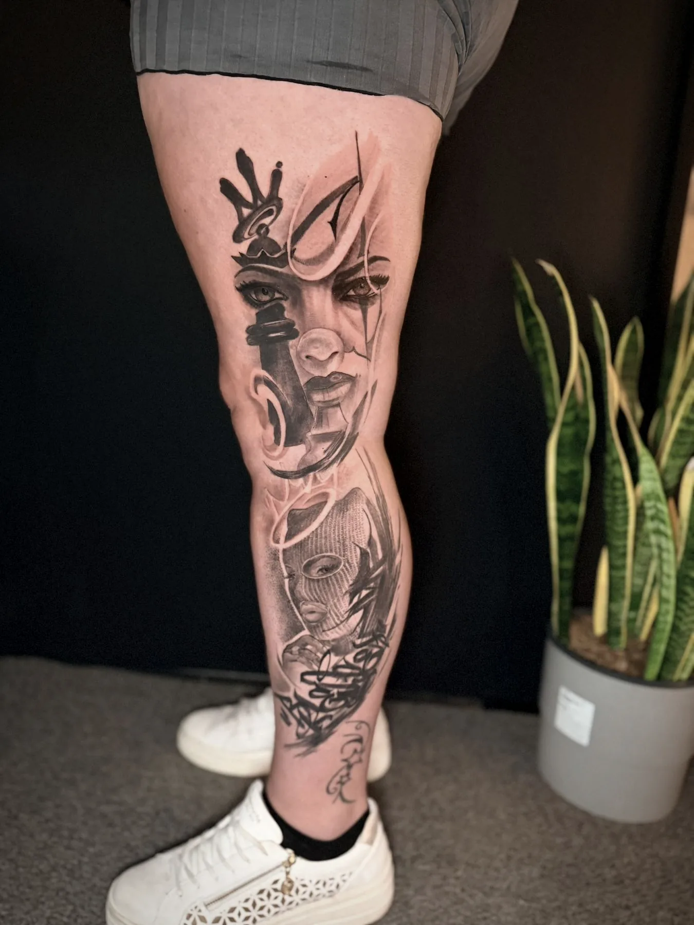 An abstract portrait sleeve, a face dissolving into brushwork down a calf.